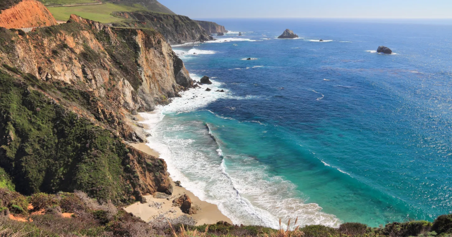 Pacific waves meeting the rugged California coastline