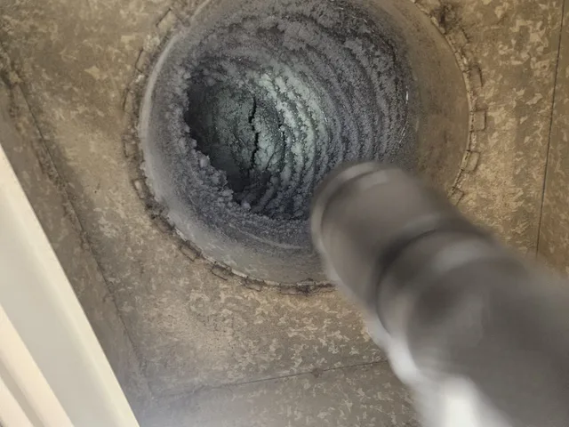 Cleaning tool inside a dust-lined duct during PAC field work
