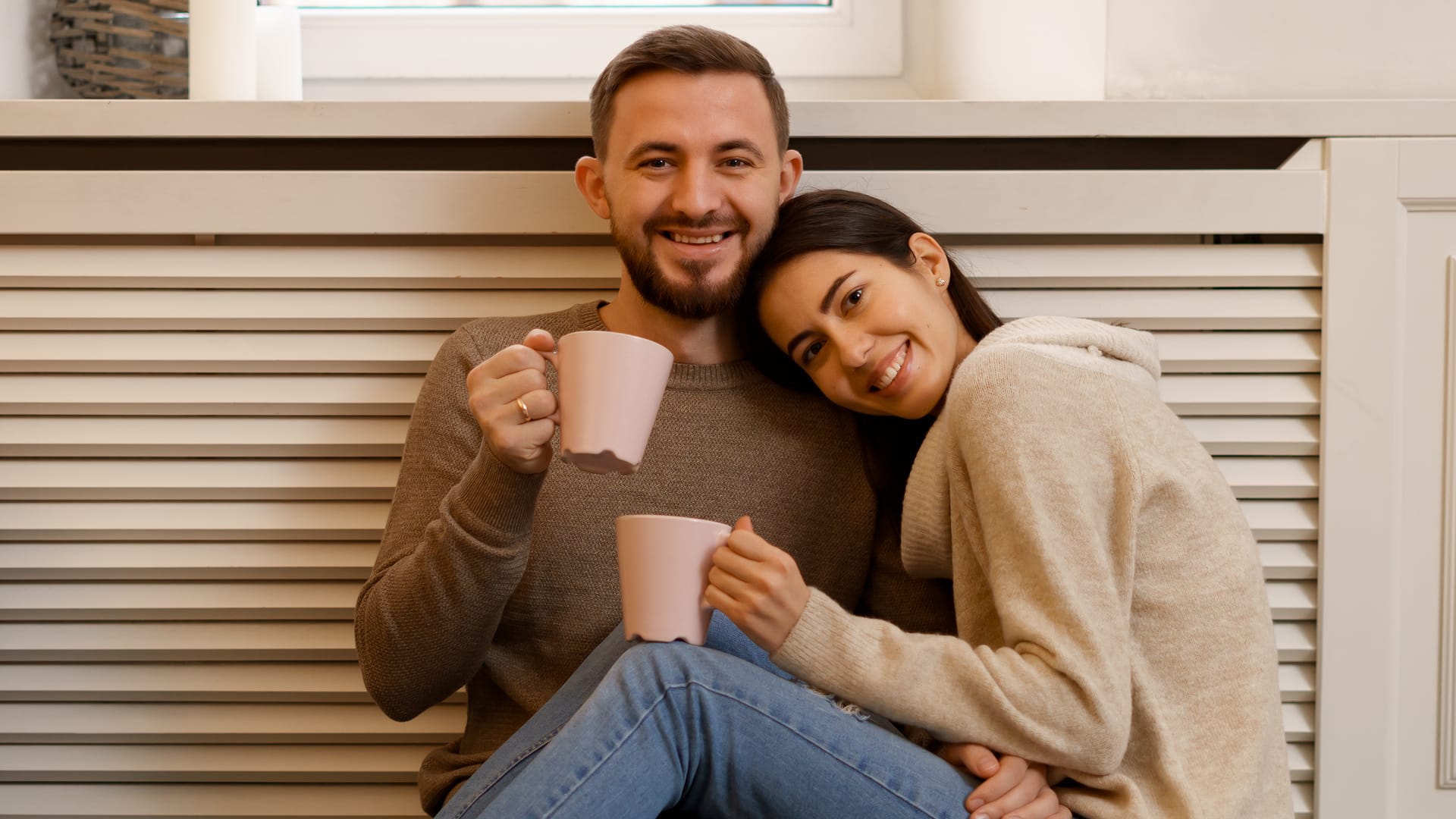 Happy couple enjoying clean air at home